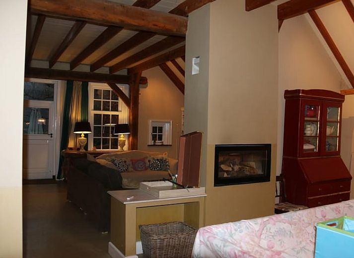 Side view of cottage in Heeten, Overijssel, with traditional thatched roof.