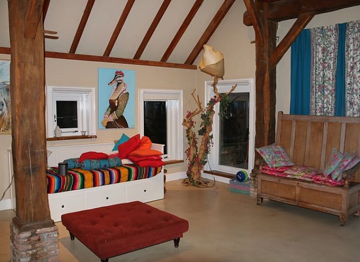 Side view of cottage in Heeten, Overijssel, with traditional thatched roof.
