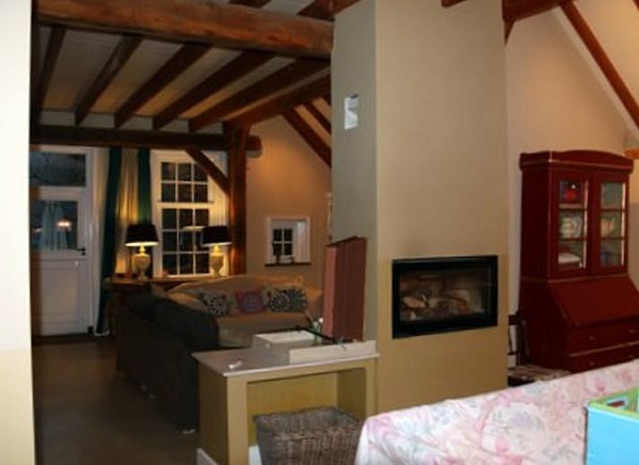 Side view of cottage in Heeten, Overijssel, with traditional thatched roof.