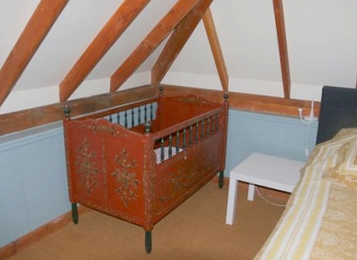 Cozy covered terrace at cottage in Heeten, ideal for outdoor dining.