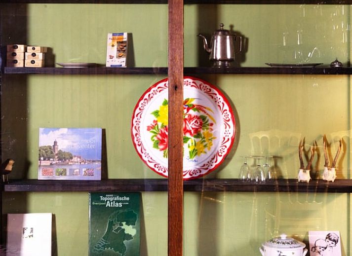 Covered table on the terrace of Holiday home in Okkenbroek, Salland, ideal for a relaxing meal in the nature of Overijssel.