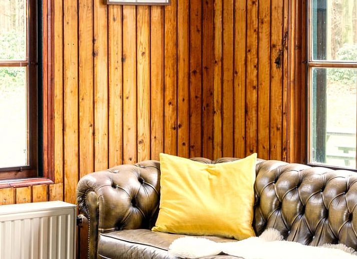 Covered table on the terrace of Holiday home in Okkenbroek, Salland, ideal for a relaxing meal in the nature of Overijssel.