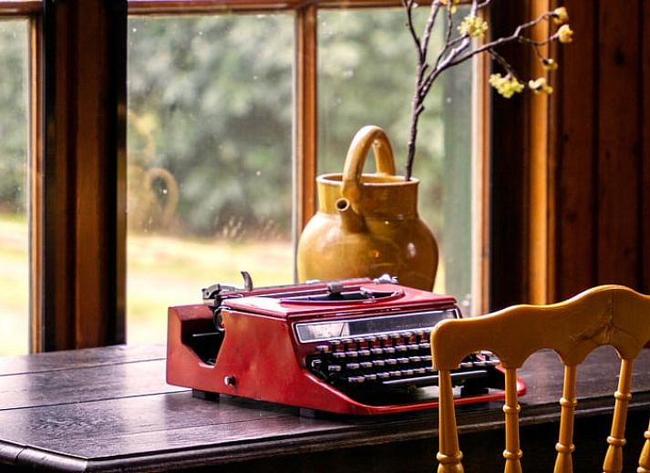 Covered table on the terrace of Holiday home in Okkenbroek, Salland, ideal for a relaxing meal in the nature of Overijssel.