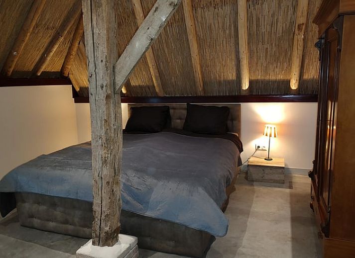 Cozy dining room in Holiday home in Nieuwleusen, Salland, with wooden table in Overijssel.