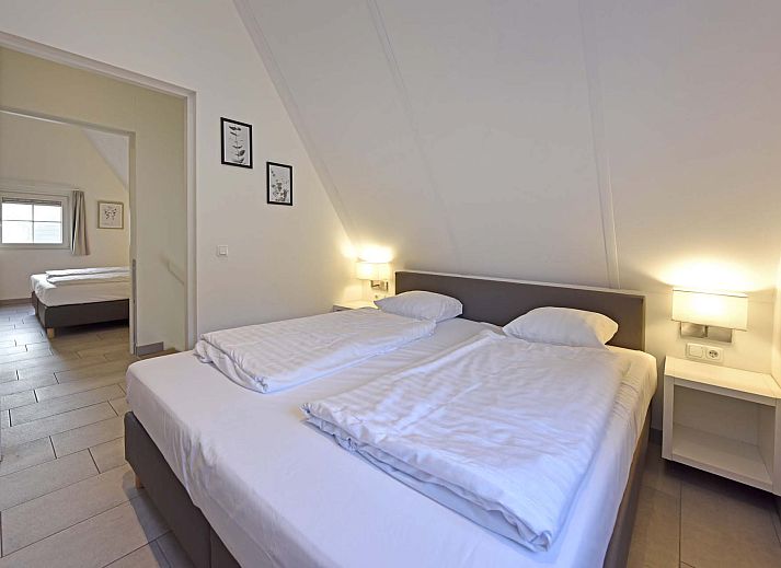 Gemtliches Wohnzimmer im Einfamilienhaus in Hellendoorn, Ferienhaus in Salland, Overijssel mit groer Sitzecke und Gartenblick.