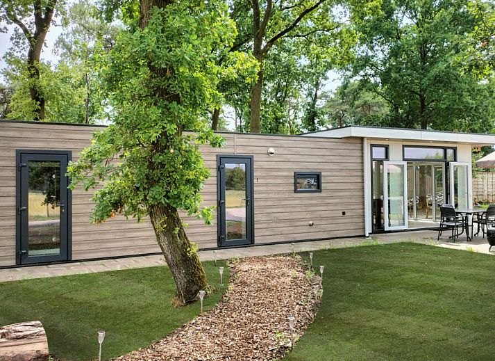 Cozy bedroom in vacation home OV751 in Haarle, Hellendoorn, with two single beds and stylish decoration, perfect for relaxation.