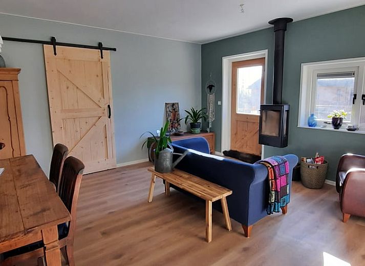 Vacation home in Wesepe, Overijssel with sunny veranda and green surroundings for a relaxing stay.