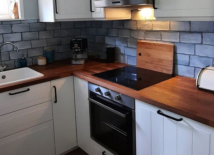 Vacation home in Wesepe, Overijssel with sunny veranda and green surroundings for a relaxing stay.