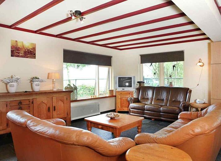 Cozy interior of vacation home OV114 in Kamperveen, Overijssel, with vintage furniture