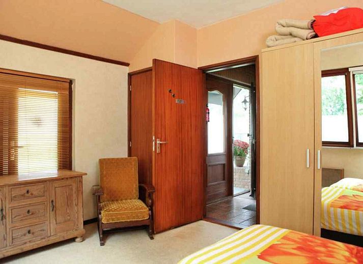 Veranda of vacation home OV114 in Kamperveen, Overijssel, with garden furniture in green surroundings