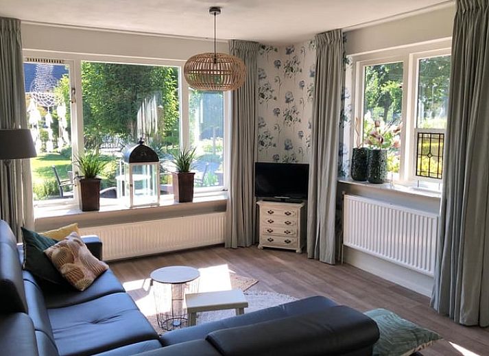 View of the vacation home Cottage in Lettele, surrounded by greenery in Salland.