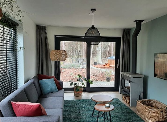 Front garden of Holiday Home in Ommen, Vecht region, Overijssel, with flowering plants.