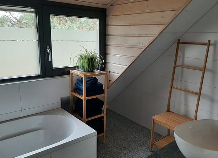 Outdoor terrace of Holiday Home in Ommen, Vechtstreek, Overijssel, with hot tub.