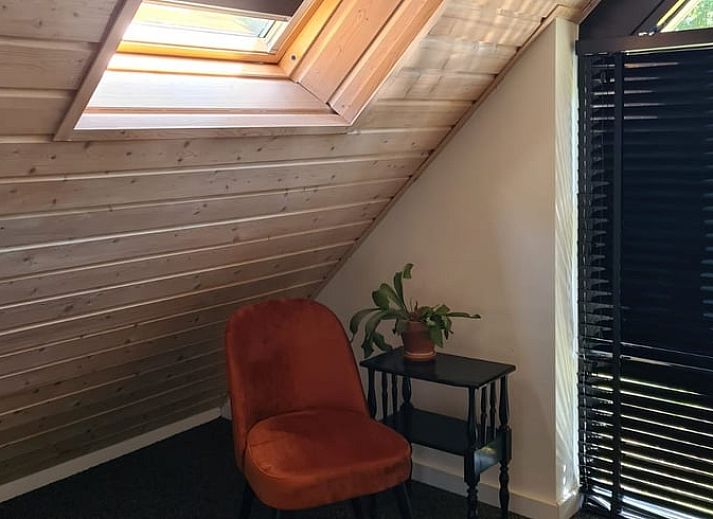 Wooden sauna at Holiday home in Ommen, Vechtstreek, Overijssel, surrounded by trees.