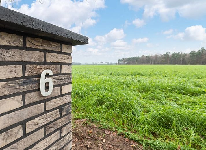 Cozy terrace at Holiday home in Ommen, surrounded by nature in the Vecht region, Overijssel, ideal for a relaxing evening outside.