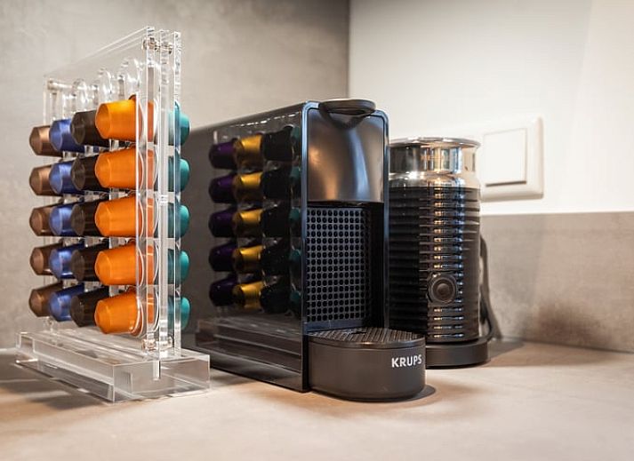 Enjoy the serene wooded garden of Holiday Home in Ommen, located in the Vecht region, Overijssel, with atmospheric lighting on the terrace.