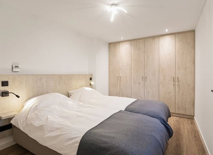 Enjoy the serene wooded garden of Holiday Home in Ommen, located in the Vecht region, Overijssel, with atmospheric lighting on the terrace.