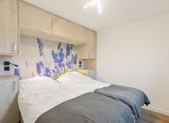 Enjoy the serene wooded garden of Holiday Home in Ommen, located in the Vecht region, Overijssel, with atmospheric lighting on the terrace.