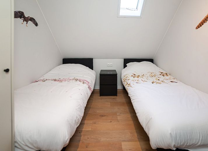 Cozy indoor space of The Buzzard vacation rental in Punthorst, Overijssel overlooking nature.