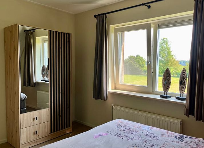 Ueberdachte Sitzecke im Ferienhaus in Beerze, Ferienhaus in Vechtstreek, Overijssel mit Blick auf Pferdeweiden.