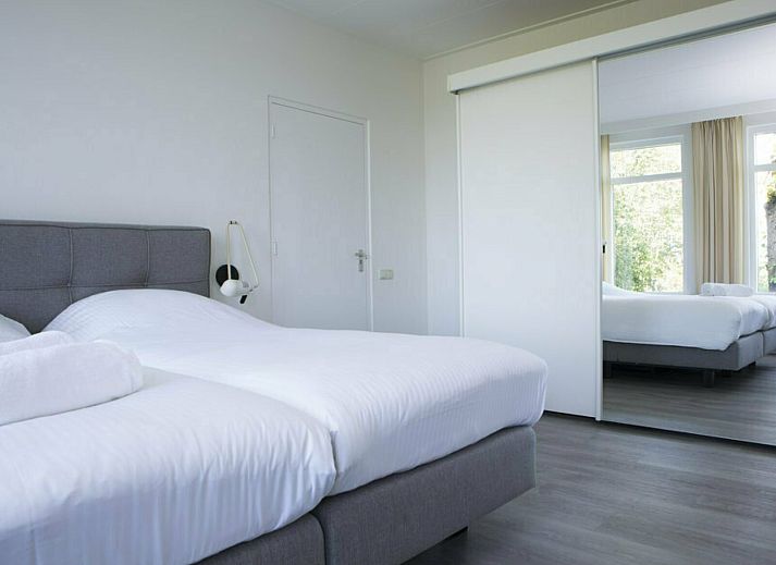 Spacious terrace at Farm de Vechtvallei, vacation home in the Vecht region, ideal for outdoor dining.