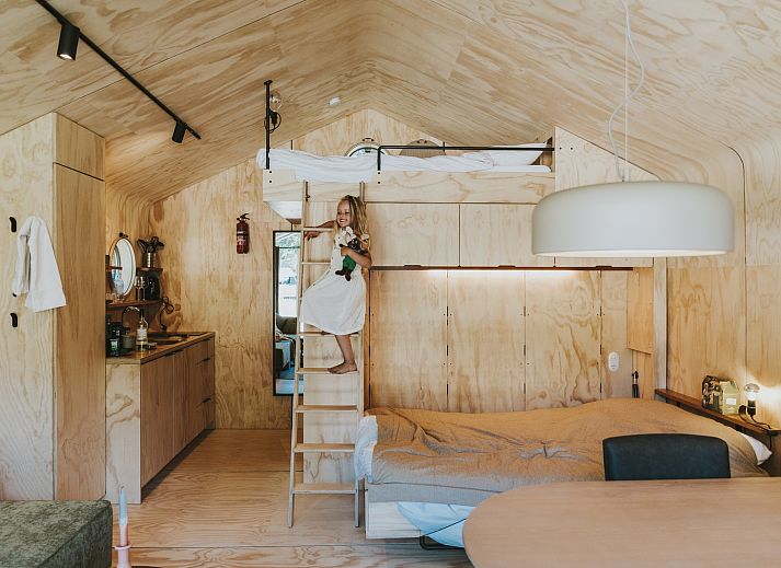 Wrap-house vacation home in Beerze with veranda and family enjoying nature in the Vecht region, Overijssel.