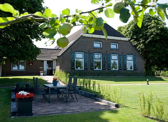 Cozy living room in Cottage in Dalfsen, cottage in the Vecht region, Overijssel with comfortable sitting area and views of nature.