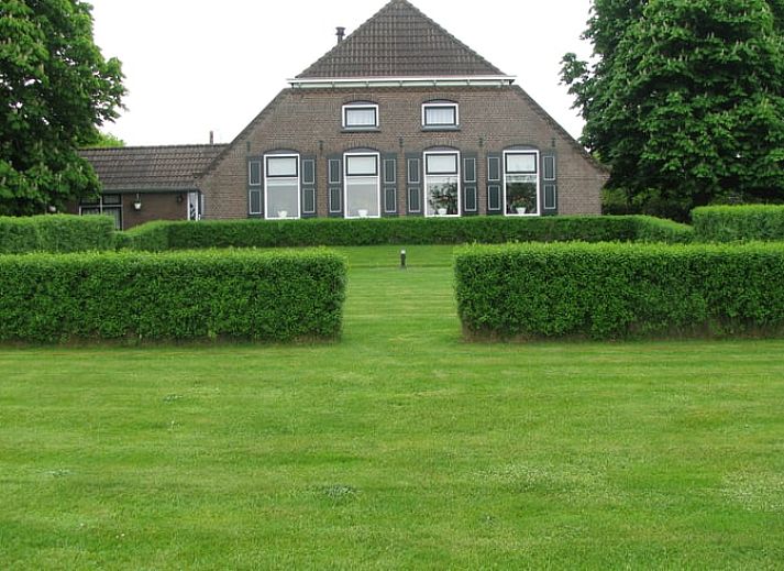 Cozy living room in Cottage in Dalfsen, cottage in the Vecht region, Overijssel with comfortable sitting area and views of nature.