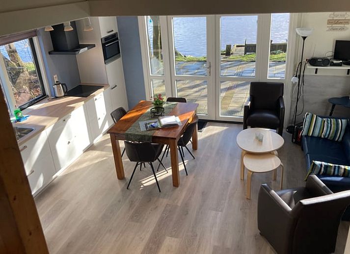 Terrace at Cottage in Dalfsen, Vecht region, Overijssel, ideal for outdoor dining in a wooded area.