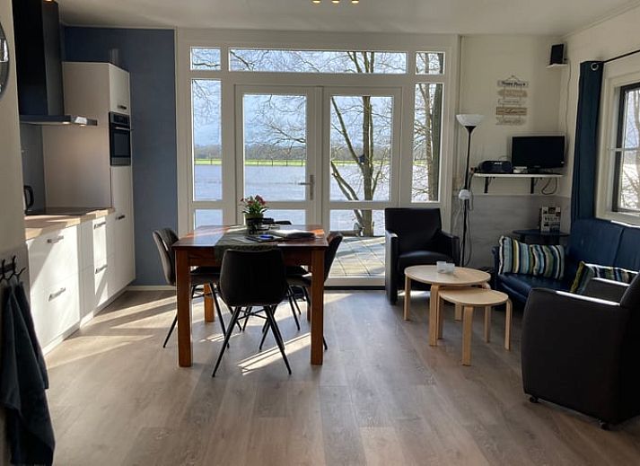 Terrace at Cottage in Dalfsen, Vecht region, Overijssel, ideal for outdoor dining in a wooded area.