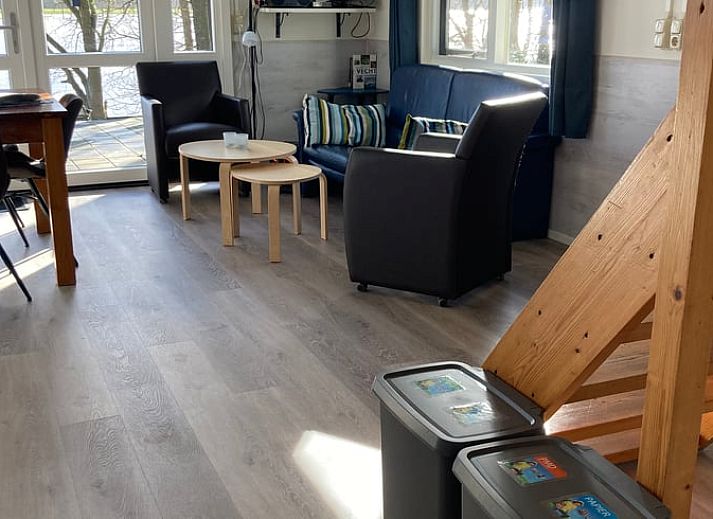 Terrace at Cottage in Dalfsen, Vecht region, Overijssel, ideal for outdoor dining in a wooded area.