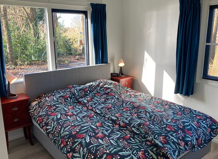 Terrace at Cottage in Dalfsen, Vecht region, Overijssel, ideal for outdoor dining in a wooded area.