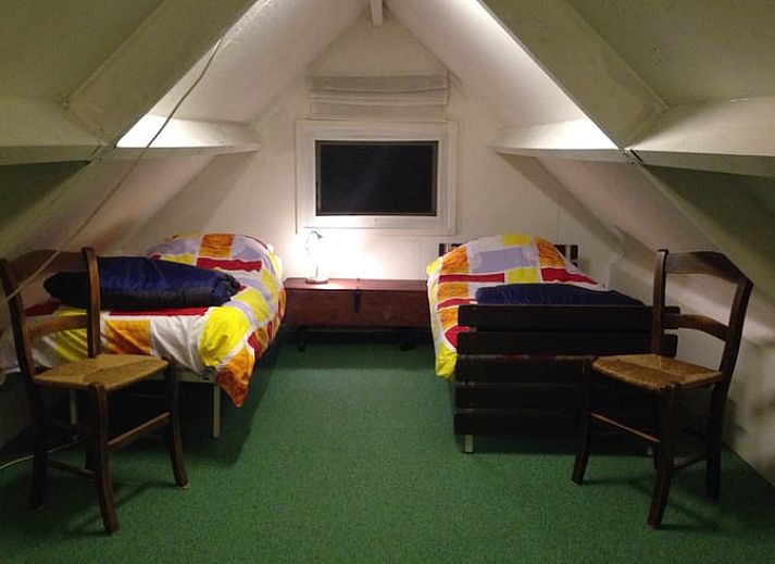Dining area in Holiday Home in Dalfsen, Overijssel, with large window overlooking the Vecht region and the water.