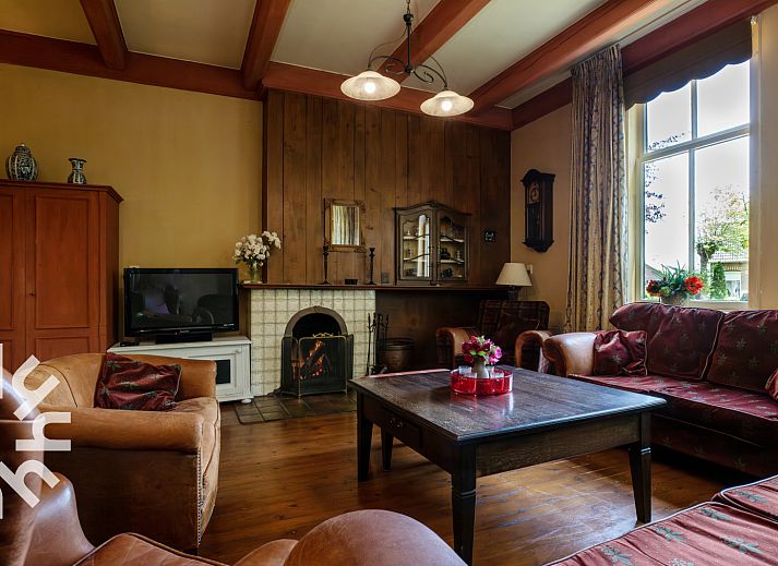 OV188 vacation home in Balkbrug, Vecht region, offers a charming brick facade surrounded by lush nature.