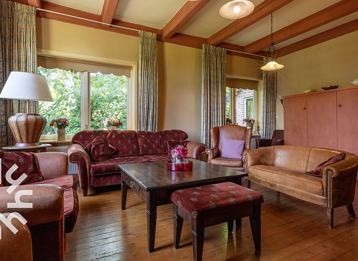 OV188 vacation home in Balkbrug, Vecht region, offers a charming brick facade surrounded by lush nature.