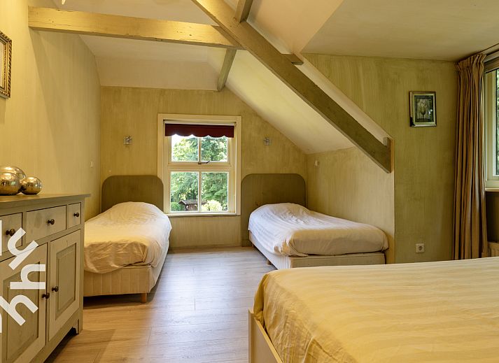 Aerial view of OV188 vacation home in Balkbrug, Vecht region, shows an idyllic pond surrounded by greenery.