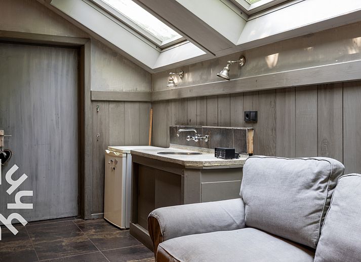 Aerial view of OV188 vacation home in Balkbrug, Vecht region, shows an idyllic pond surrounded by greenery.