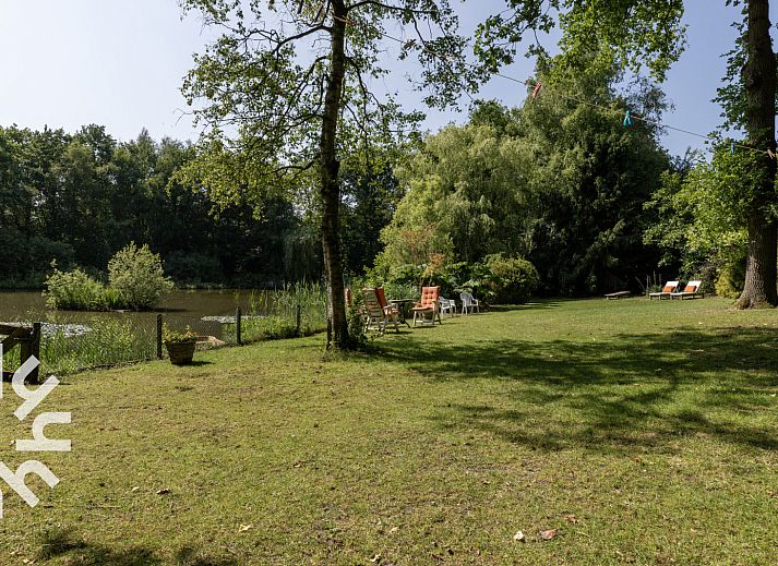 Aerial view of OV188 vacation home in Balkbrug, Vecht region, shows an idyllic pond surrounded by greenery.