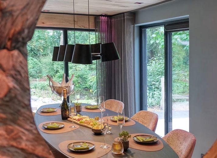 Bubbling hot tub in the garden of cottage in Rheezerveen, Vechtstreek, Overijssel surrounded by nature.