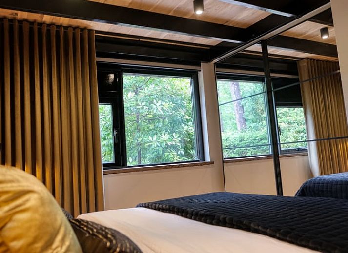 Bubbling hot tub in the garden of cottage in Rheezerveen, Vechtstreek, Overijssel surrounded by nature.