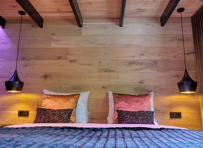 Covered porch with wood-burning stove at cottage in Rheezerveen, Vechtstreek, Overijssel for a cozy outdoor experience.