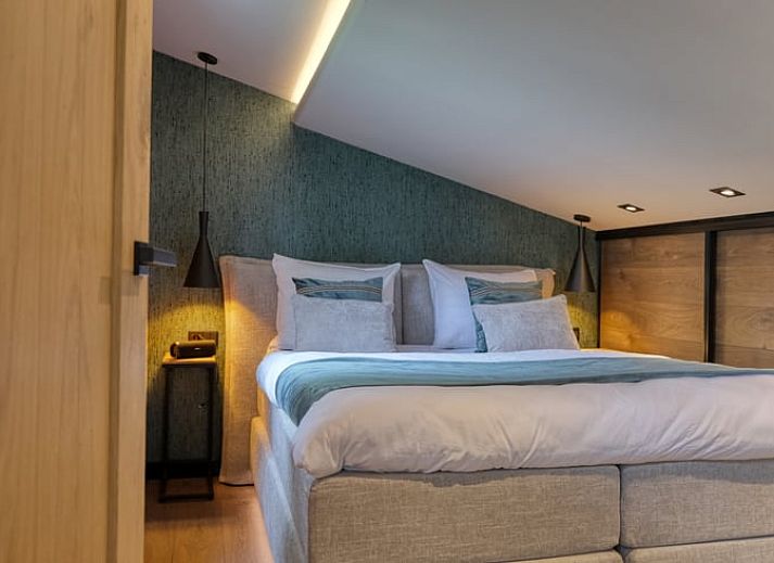 Covered porch with wood-burning stove at cottage in Rheezerveen, Vechtstreek, Overijssel for a cozy outdoor experience.