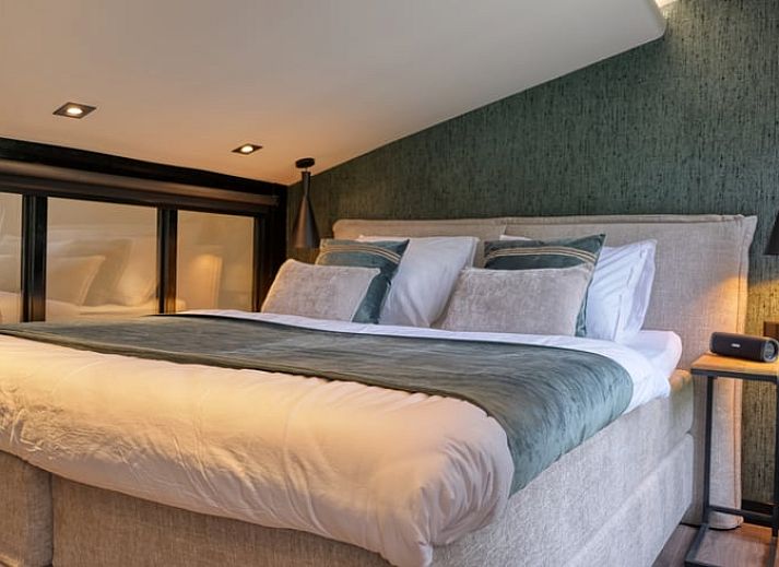 Covered porch with wood-burning stove at cottage in Rheezerveen, Vechtstreek, Overijssel for a cozy outdoor experience.