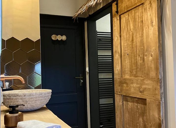 Attractive bedroom in Holiday cottage in Giethmen, Vechtstreek, Overijssel with wooden interior and comfortable beds.