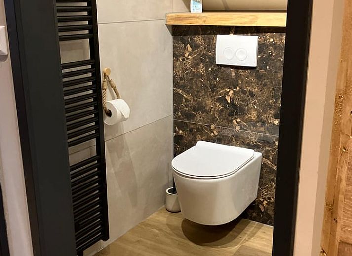 Attractive bedroom in Holiday cottage in Giethmen, Vechtstreek, Overijssel with wooden interior and comfortable beds.