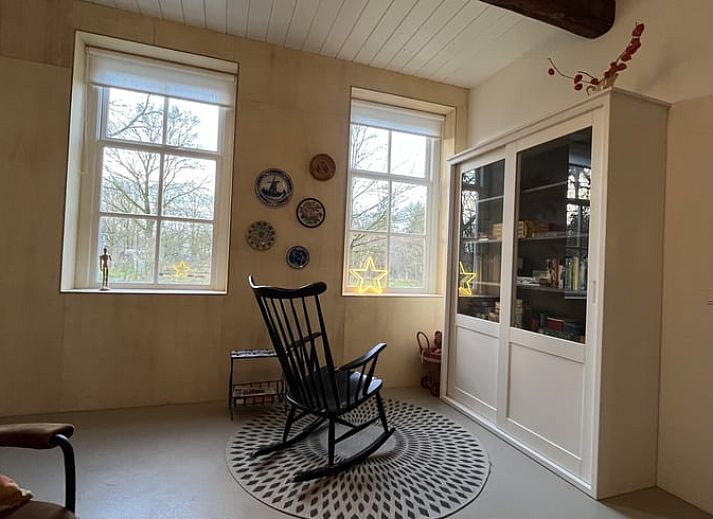 Cozy dining area in Holiday Home in Radewijk, Vechtstreek, Overijssel with wooden table.