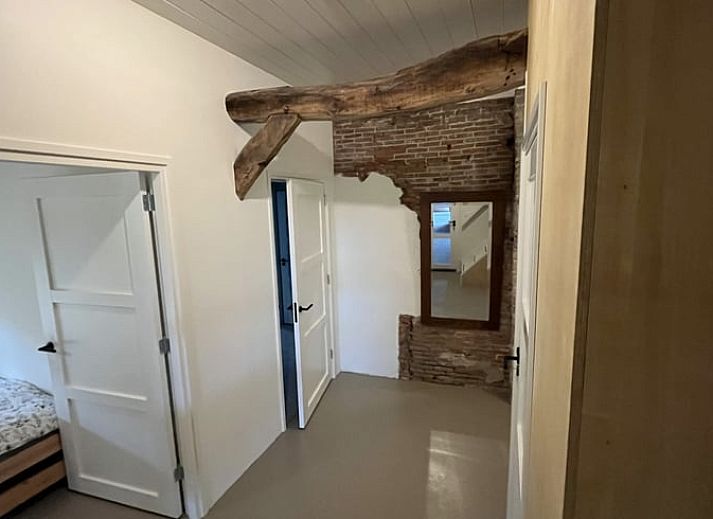 Cozy dining area in Holiday Home in Radewijk, Vechtstreek, Overijssel with wooden table.