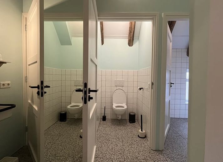 Cozy dining area in Holiday Home in Radewijk, Vechtstreek, Overijssel with wooden table.