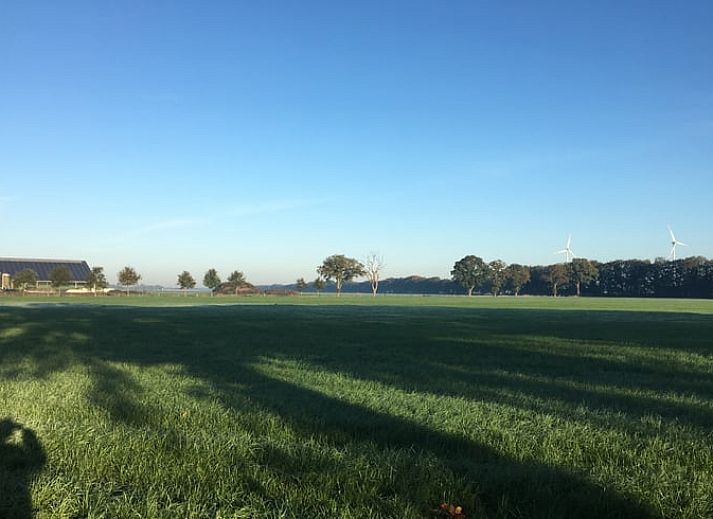 Spacious living room in Holiday home in Radewijk, Vechtstreek, Overijssel with glass doors.