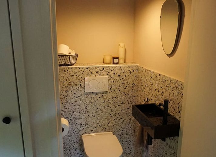 Knusse zithoek met houtkachel in Vakantiehuisje in Stegeren, Vechtstreek, Overijssel.